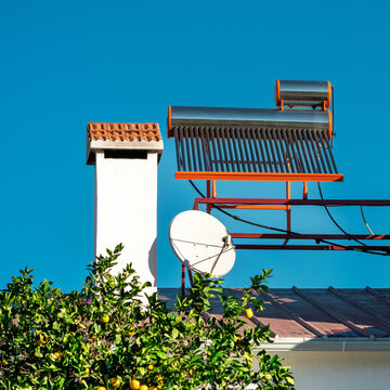 solar thermal water heating collector on the roof of the house