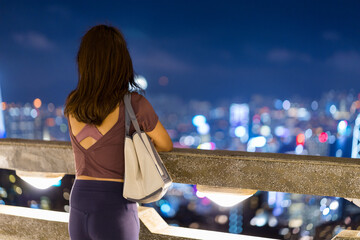 Woman look at the view of Hong Kong city