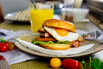 Egg, sausage and bacon breakfast bun.