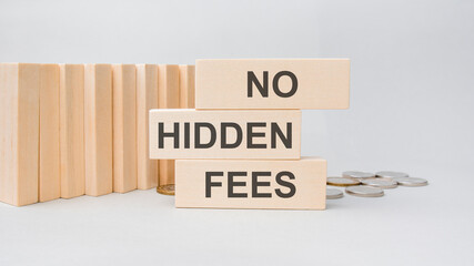 No hidden fees word written on wooden blocks. Taxes and fees optimi zation Financial business concept.