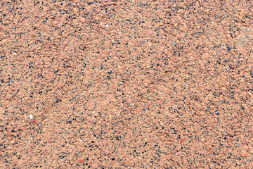 surface consisting of texture of small stones on an orange background