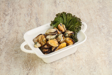 Tasty marinated mussels in the bowl