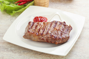 Grilled rib-eye steak beef meat