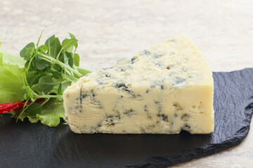 Blue cheese piece over board