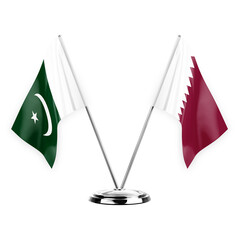 Two table flags isolated on white background 3d illustration, pakistan and qatar