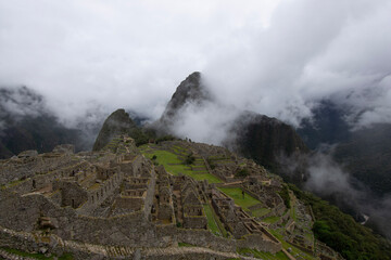 Views of Macchu PIcchu amidst the clouds in Peru