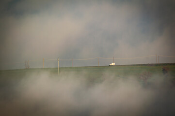 Fototapeta na wymiar Layers of fog color a winter day