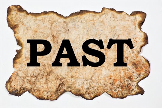 Past. A word on a vintage piece of paper with burnt edges. A lot of events preceding the present.