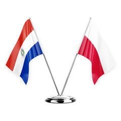 Two table flags isolated on white background 3d illustration, paraguay and poland