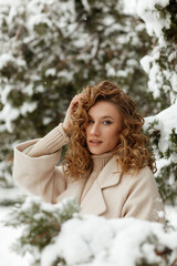 Young beautiful woman on a snowy street