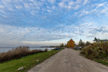 Colorful sunrise on the shores of Lake Nero. Autumn landscape with a lake in the early morning. A...