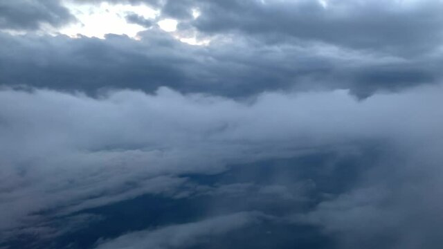 Above the dramatic moody storm clouds from an aeroplane