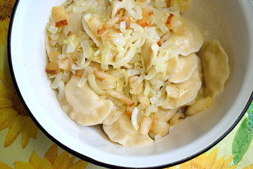 homemade dumplings with onion and bacon, close-up as texture for background