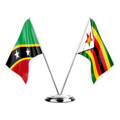 Two table flags isolated on white background 3d illustration, saint kitts and venis and zimbabwe