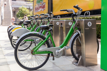 Bicycles parking. Parking stations provide bicycles for people to help them commute the city without using a car, Stations provide bicycles for people to help them commute the city without using a car