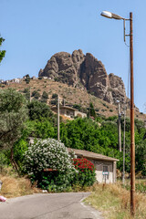 Obraz premium Small village of Pentedattilo, church and ruins of the abandoned village, Greek colony on Mount Calvario, whose form recalls the five fingers. Calabria, Italy
