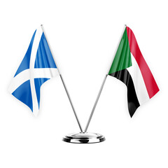 Two table flags isolated on white background 3d illustration, scotland and sudan
