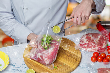 Chef pack vacuum bag with meat and lime on blurred background.