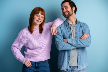 Portrait view of the young beautiful caucasian man and woman smiling and posing