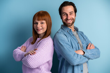 Positive independent student man woman wear casual style clothes standing cross hands back-to-back
