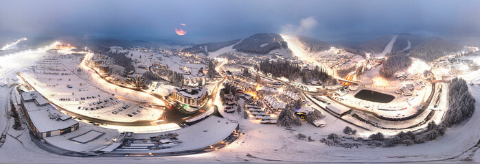 Flight over the ski resort at night, 360 degree panorama.
