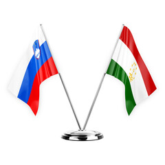 Two table flags isolated on white background 3d illustration, slovenia and tajikistan