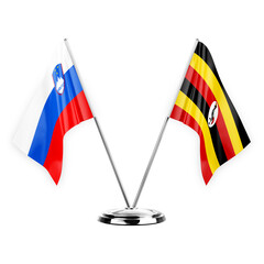 Two table flags isolated on white background 3d illustration, slovenia and uganda