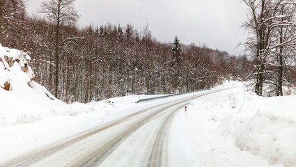 Fototapeta premium winter road in the forest