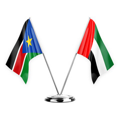 Two table flags isolated on white background 3d illustration, south sudan and united arab emirates