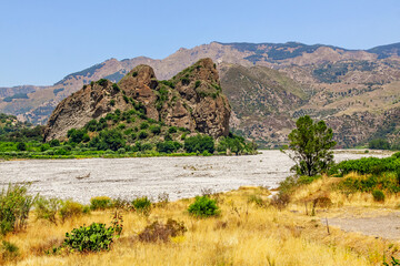 Wild landscape of Calabria. The Fiumara (river) of Amendolea in the Aspromonte National Park with bridge, Calabria, Italy