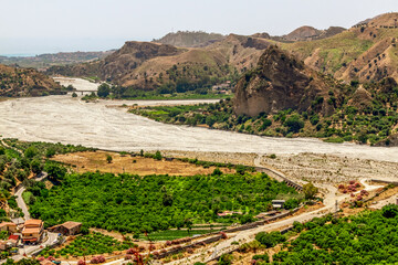 Wild landscape of Calabria. The Fiumara (river) of Amendolea in the Aspromonte National Park with bridge, Calabria, Italy