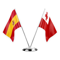 Two table flags isolated on white background 3d illustration, spain and tonga