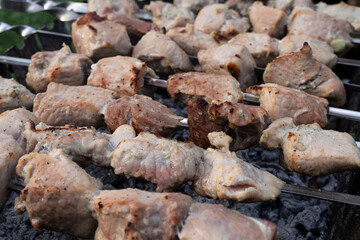 Cooking large pieces of appetizing barbecue on the grill
