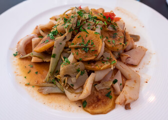 A typical Mediterranean dish - calamari with artichokes and vegetables