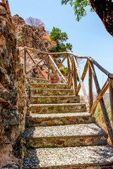 Fototapeta na wymiar The ruins of the castle Castello Ruffo. Ruin of a Ghost Town in National Park Aspromonte with the Fiumara (river) of Amendolea, Calabria, Italy
