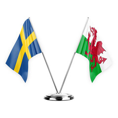 Two table flags isolated on white background 3d illustration, sweden and wales