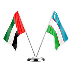 Two table flags isolated on white background 3d illustration, united arab emirates and uzbekistan