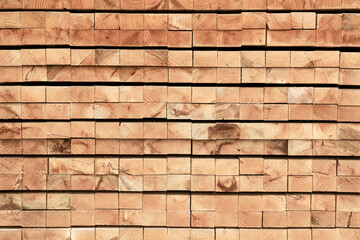 Natural Wood planks stock background on construction site. lumbers in a sawmill