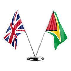 Two table flags isolated on white background 3d illustration, united kingdom and guyana