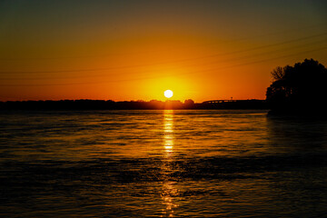 Sunrise and sunset on St. Lawrence river 