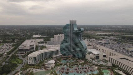 Orbiting aerial of dramatic architecture of Seminole Hard Rock Hotel