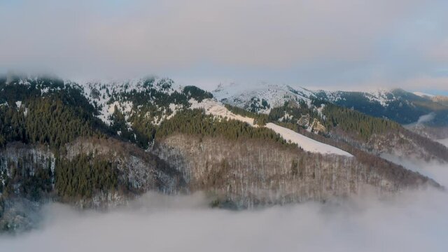 Foggy winter view of Carpathian mountains in Romania. 4k