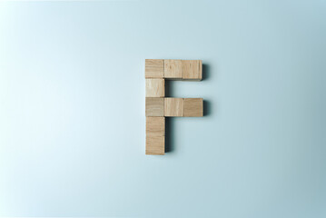 Letter F from wooden dice White Background