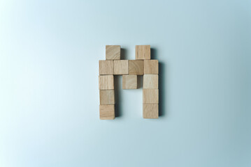 Letter M from wooden dice White Background