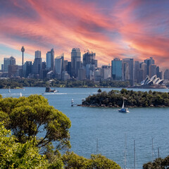 Obraz premium View of Sydney Harbour NSW Australia. Ferry boats partly cloudy colourful skies blue waters
