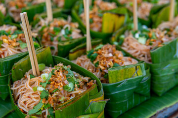 Small serving of Pad Thai in leaf on street