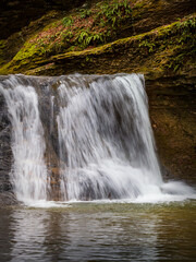 Natural riverbed and waterfalls on a mountain river, autumn in a natural park, walking in picturesque places..-.