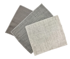 bright collection of gunny textile fabric samples in grey color tone. stacked of drapery fabric samples isolated on background with clipping path. material, fabric, manufacturing, garment factory.