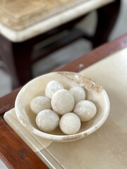 A marble plate with a marble ball on it