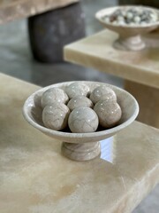 A marble plate with a marble ball on it